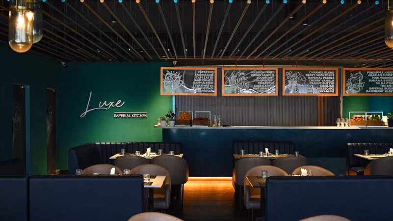 Family dining at Imperial Kitchen, restaurant in Kowdiar